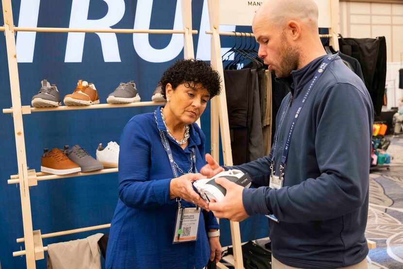 Marilinda Scarsella, merchandise manager for Grey Oaks Country Club in Naples, Fla., listens...