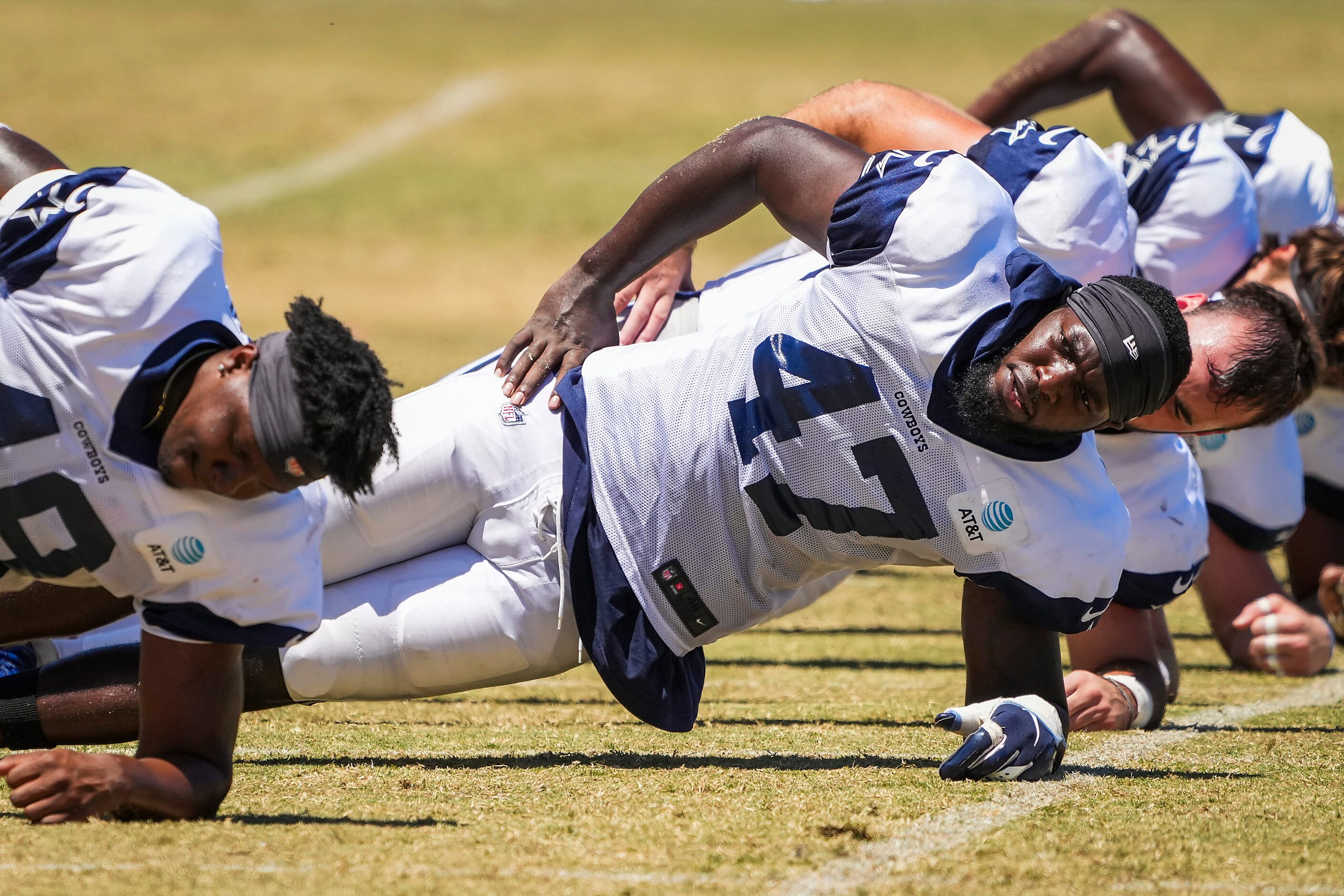 Dallas Cowboys tight end Nick Eubanks (47) does conditioning with teammates including tight...