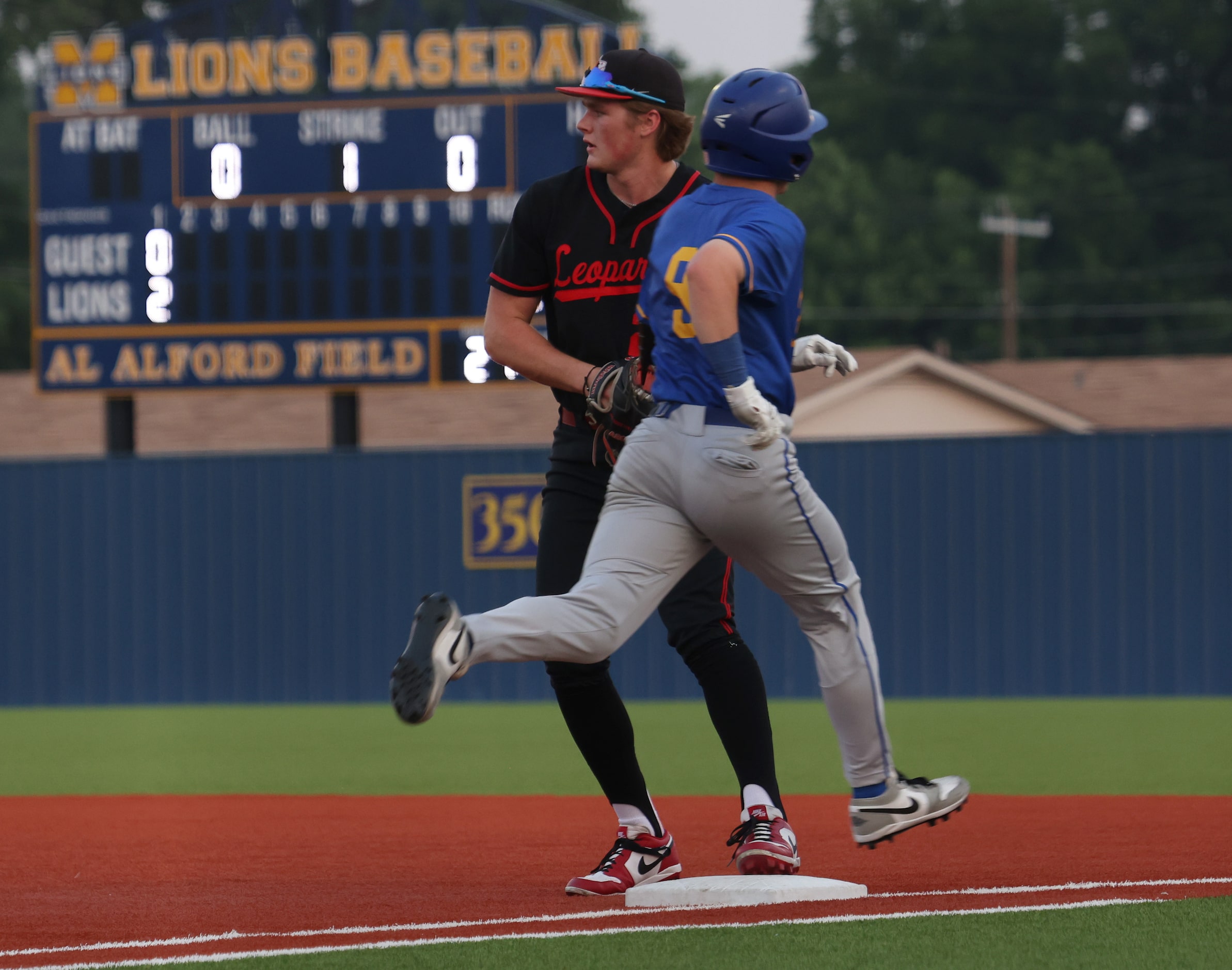 Fresco's Thomas Mulkern (9) is retired on an infield grounder as Lovejoy first baseman...