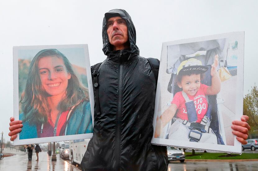 Tarek Milleron holds the photographs of victims in the Ethiopian Airlines Flight 302 Boeing...