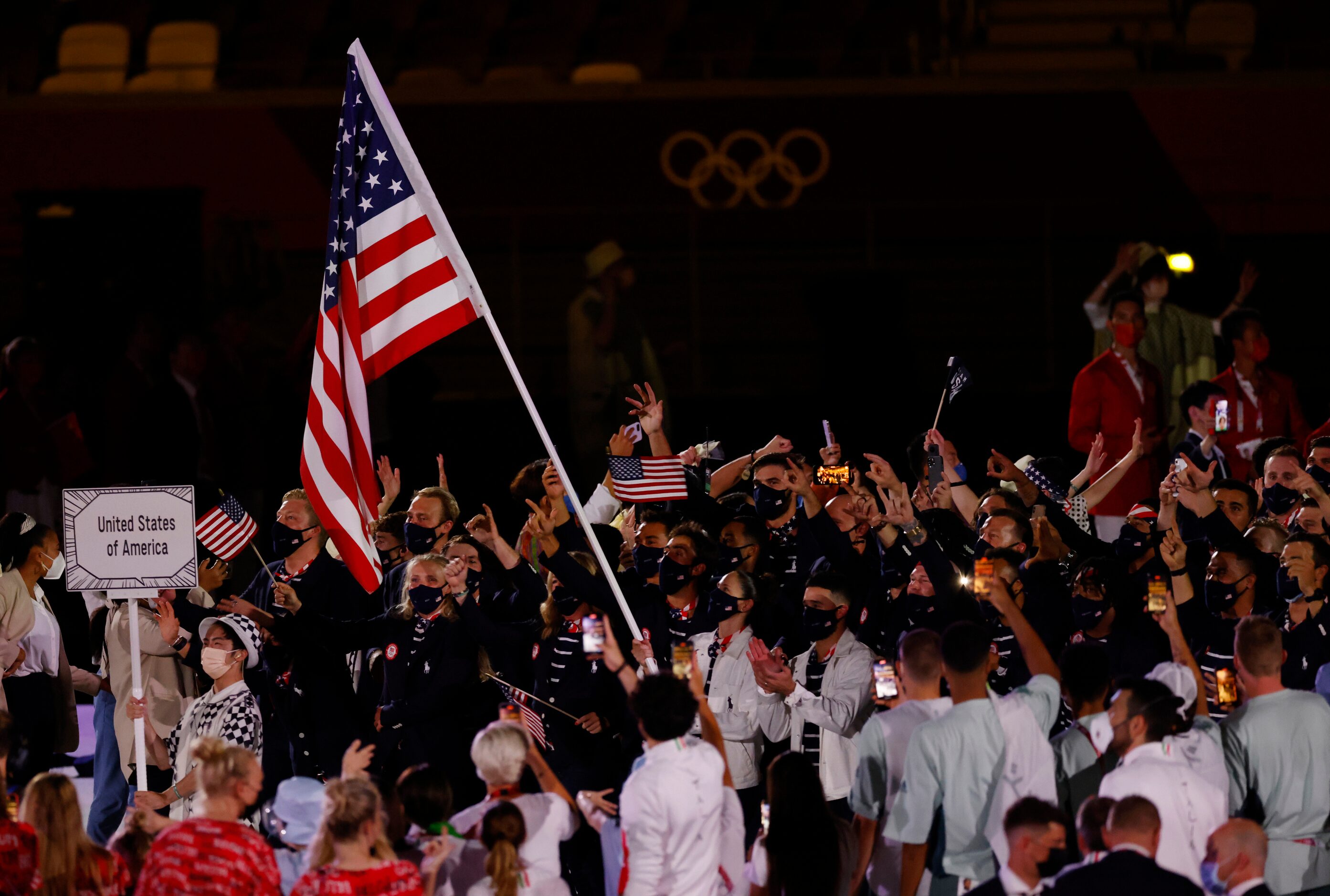 Team USA's Sue Bird carries the flag as Team USA makes their way across the stage during the...