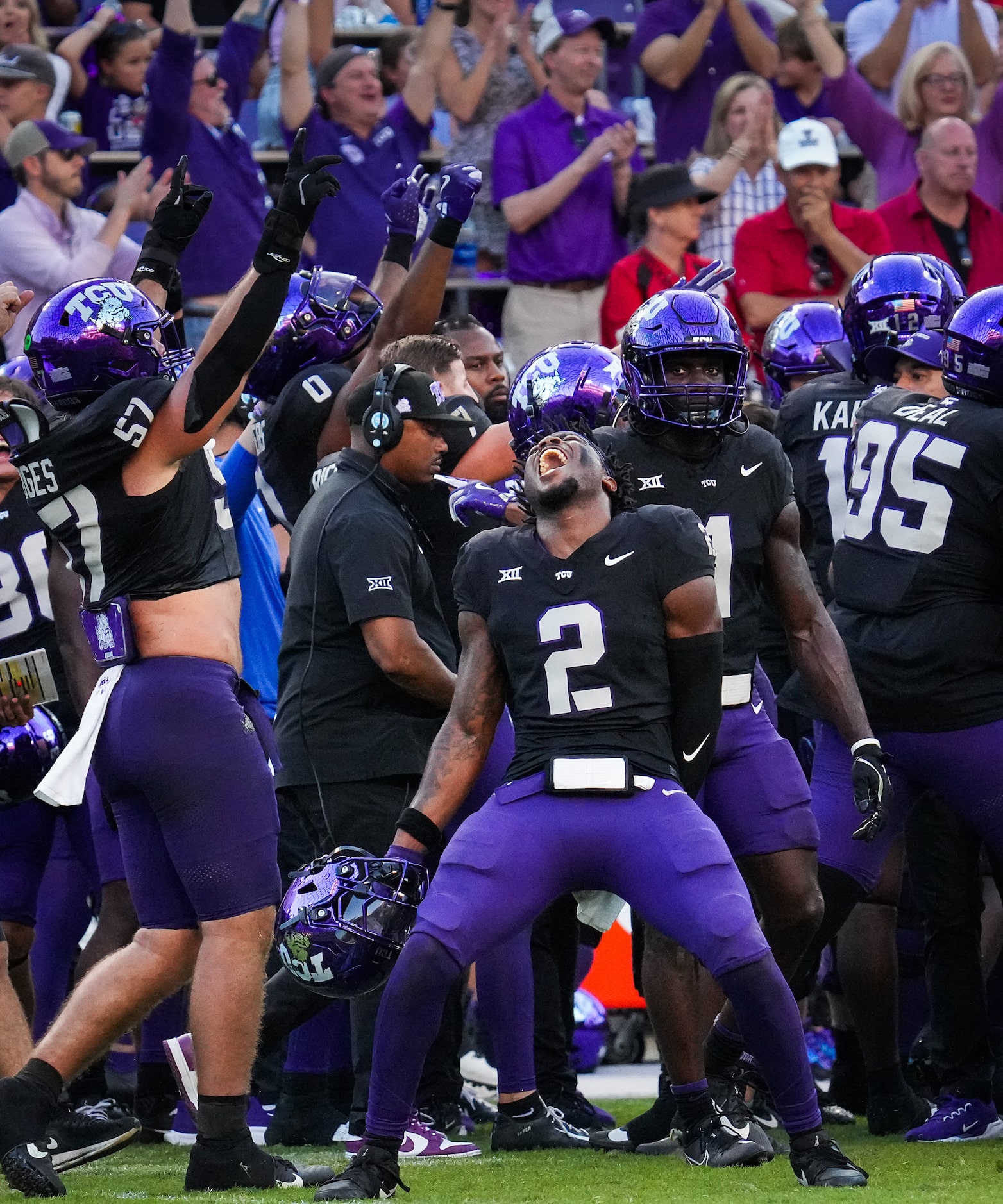 TCU safety Jamel Johnson (2) and linebacker Johnny Hodges (57) celebrate after a replay...