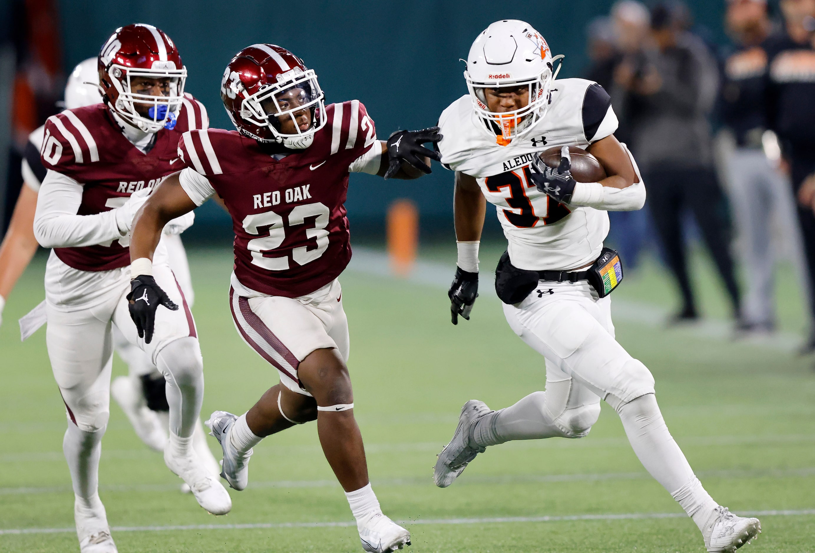 Aledo running back Kaden Winkfield (37) breaks away from Red Oak’s Darias Butler (23) and TJ...