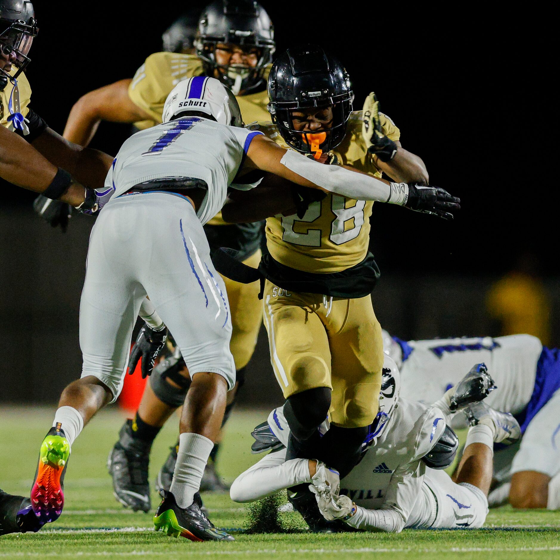 Seagoville defensive back Aaron Carter (7) tackles South Oak Cliff running back Izale...