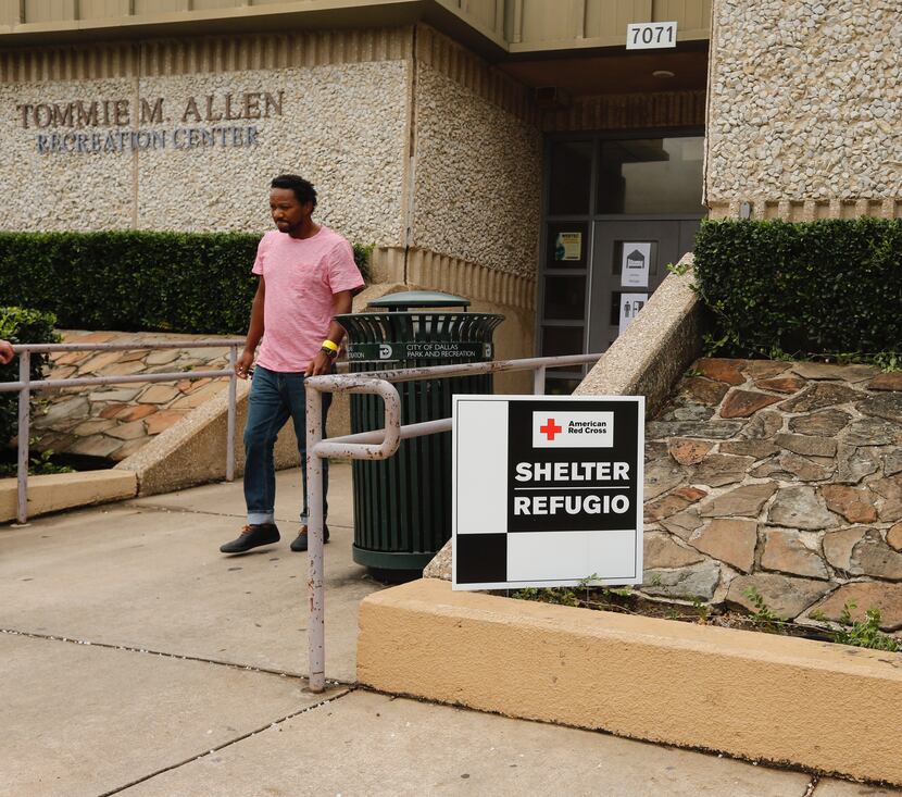 Troy Van Reenen from Houston heads to his car to get some more blankets while staying at the...