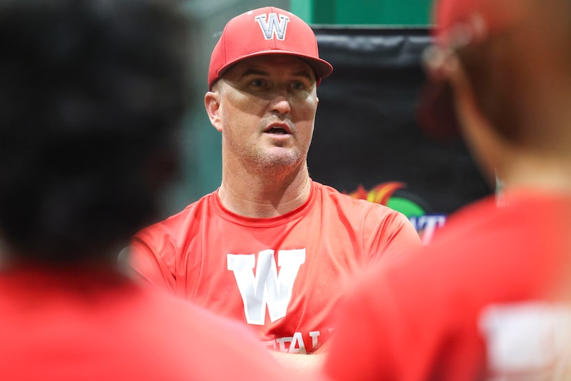 Woodrow Wilson High baseball team head coach Gill Nelson (top right) talks to the players...