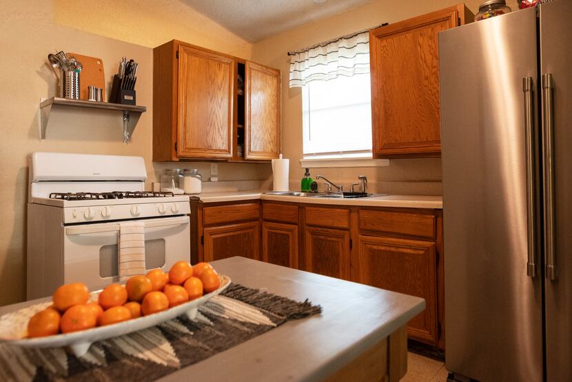 Kimberly Bobb's newly decorated kitchen includes a full-size refrigerator, which replaces...