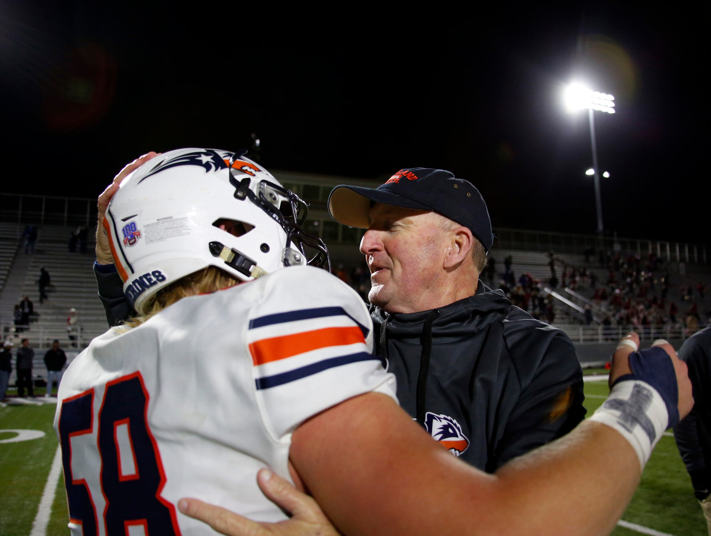 Frisco Wakeland head coach Marty Secord celebrates with Wolverines senior offensive lineman...