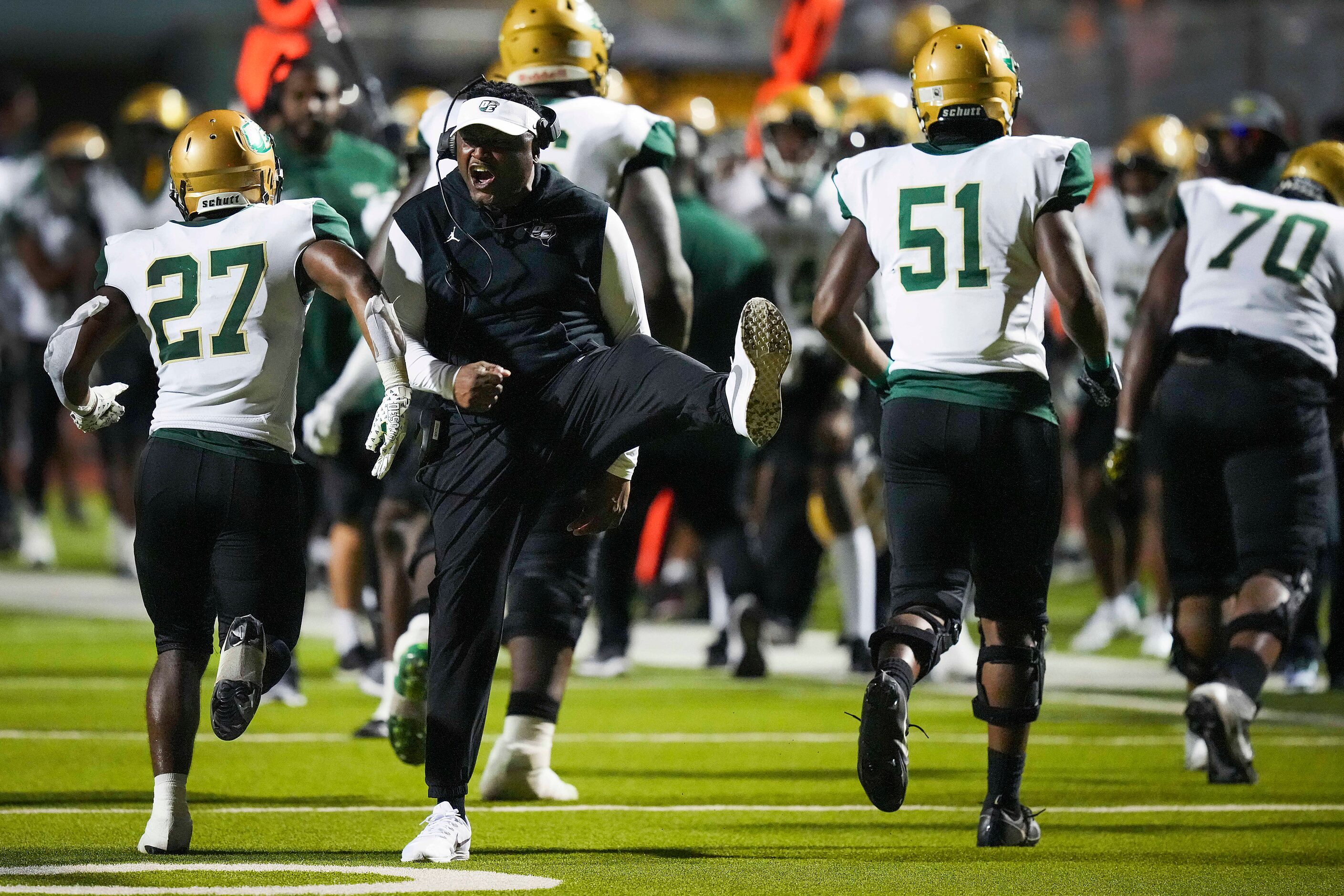 DeSoto  head coach Claude Mathis head coach Claude Mathis celebrates a touchdown during the...