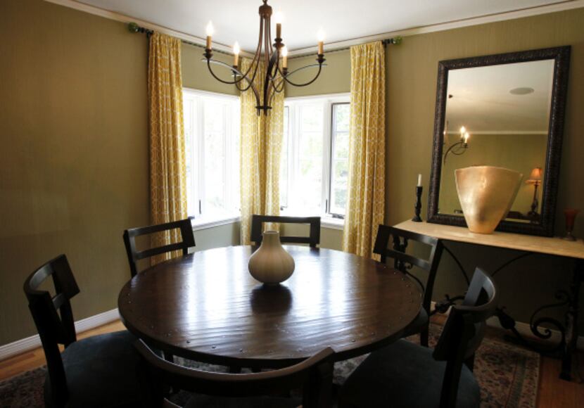 Johnson gave new life to the Dilbeck dining room by repainting walls a golden hue.