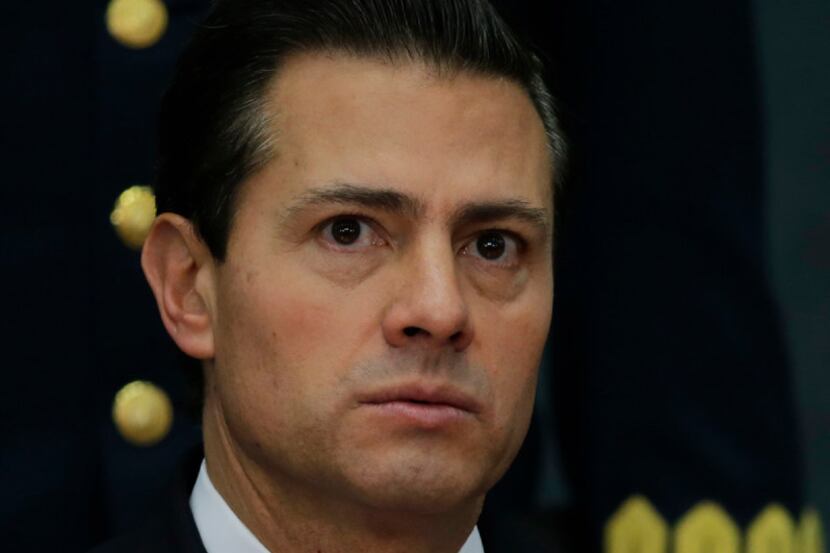 Mexico's President Enrique Pena Nieto during a press conference at Los Pinos presidential...