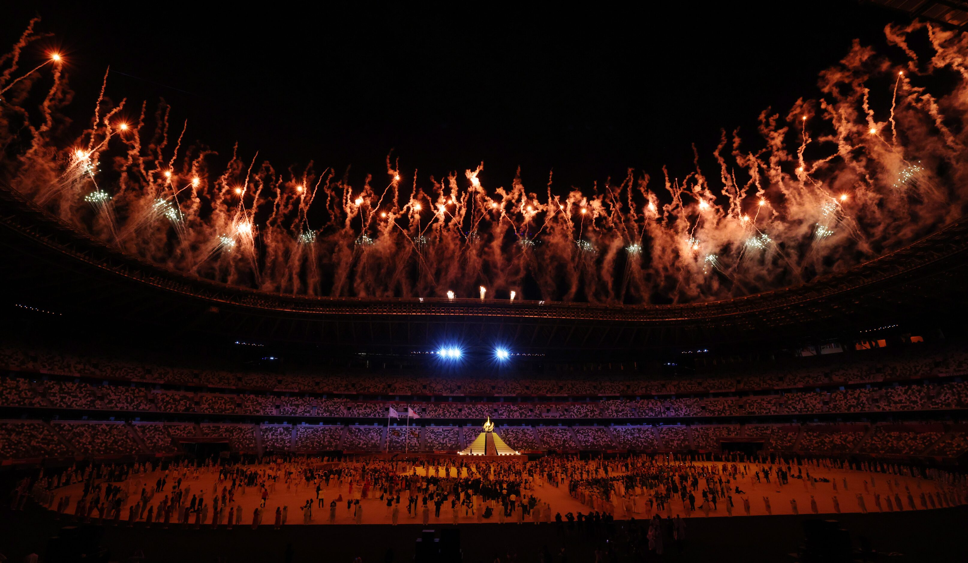 Fireworks go off after the Olympic cauldron was lit during the opening ceremony for the...