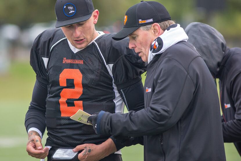 Former Texas A&M and Cleveland Browns QB Johnny Manziel (2) of the South team converses with...