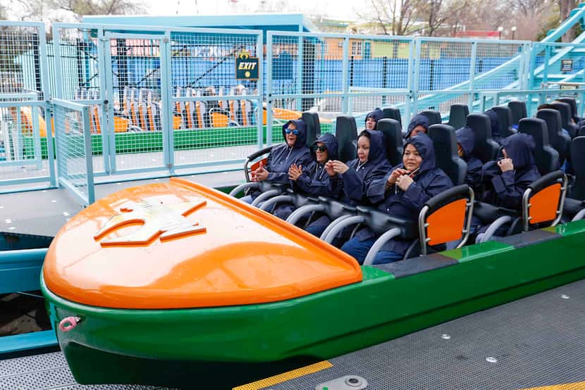 Attendees prepared to ride the new Aquaman water coaster Thursday at Six Flags Over Texas in...