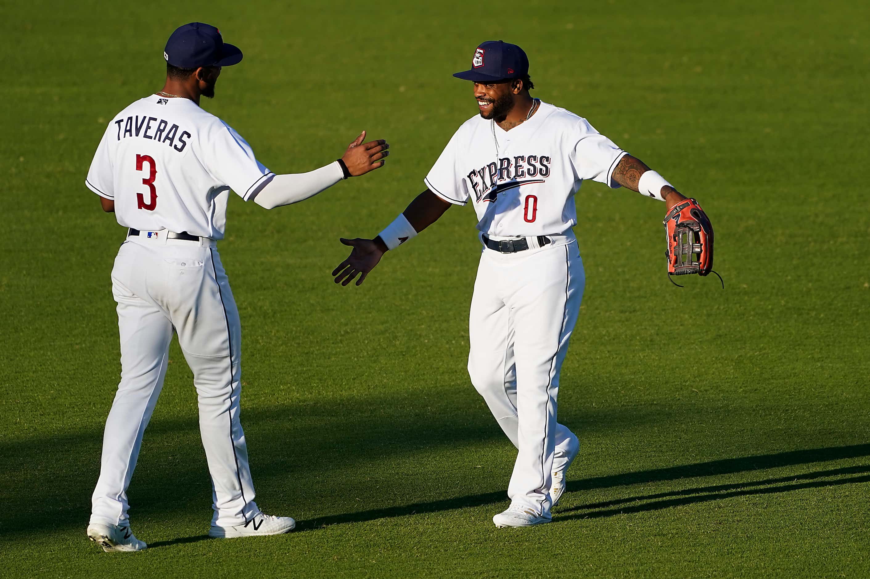 Round Rock Express outfielders Delino DeShields and Leody Taveras take the field for the...
