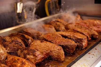 Kitchen crews working for Cris Vázquez, the executive chef of the Texas Rangers, prepared...