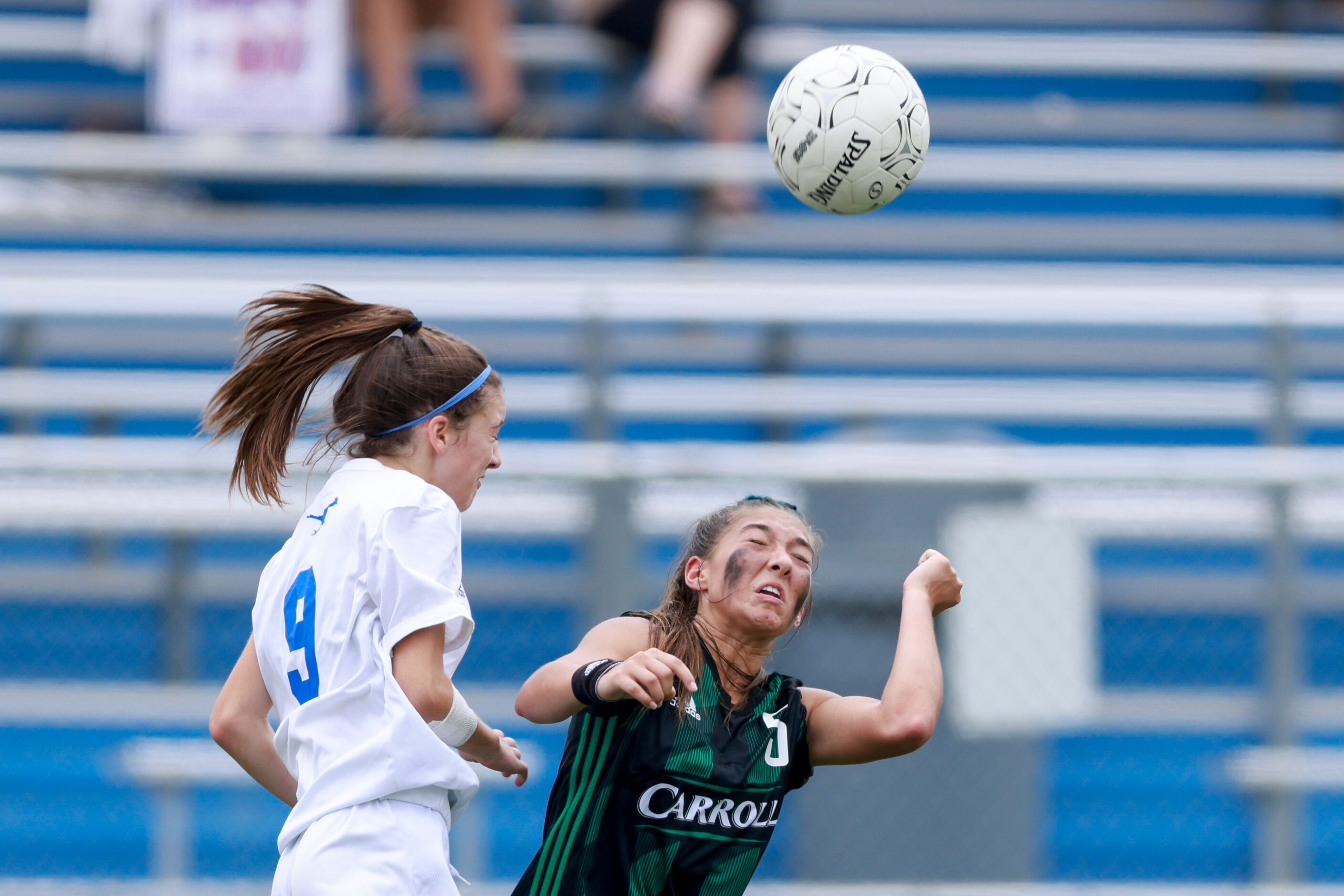 Austin Westlake defender Kaitlin Ogilvie heads the ball over Southlake forward Madison Khan...