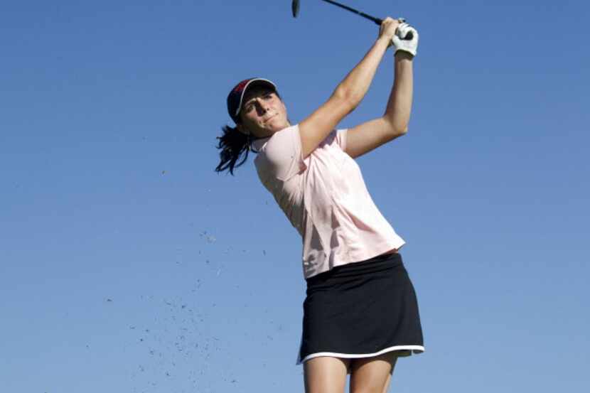 Anya Anders hits the ball off of the fairwayl during Carrollton Creekview's golf practice at...