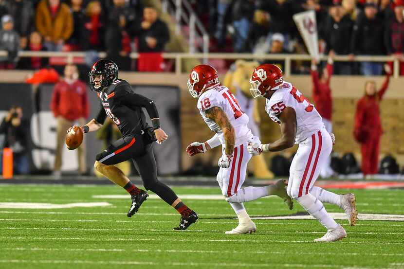 LUBBOCK, TX - NOVEMBER 03: Alan Bowman #10 of the Texas Tech Red Raiders scrambles with the...