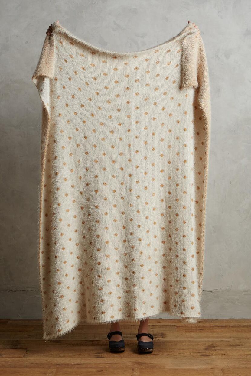 Tie other neutrals  into your color palette with items such as Anthropologie's Cozy Dot...