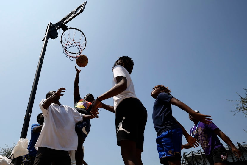 Young people play basketball during a back-to-school event Aug. 10, 2024, at the recreation...