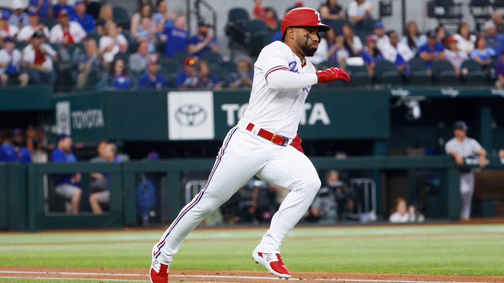 Texas Rangers shortstop Ezequiel Duran singles on a line drive during the first inning of a...