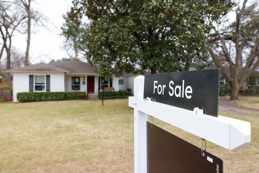 A “for sale” sign is displayed outside a house on Wednesday, Jan. 19, 2022 in Dallas, TX.
