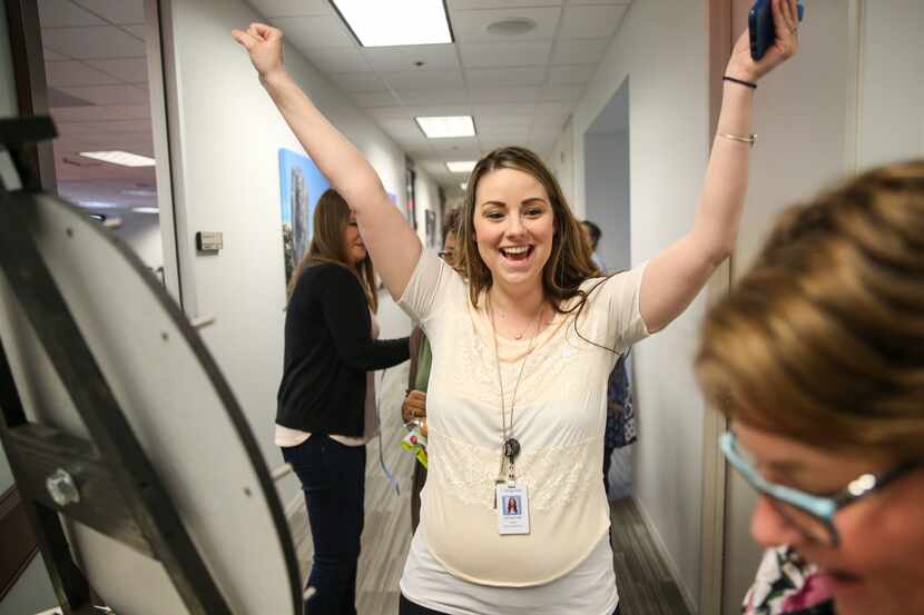 Jacqueline Lopez wins a prize during a National Payroll Week lunch celebration at Insperity...