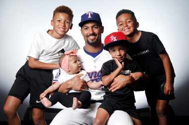 Texas Rangers' Marcus Semien and his children (from left), Isaiah, Amelie, Eli and Joshua,...