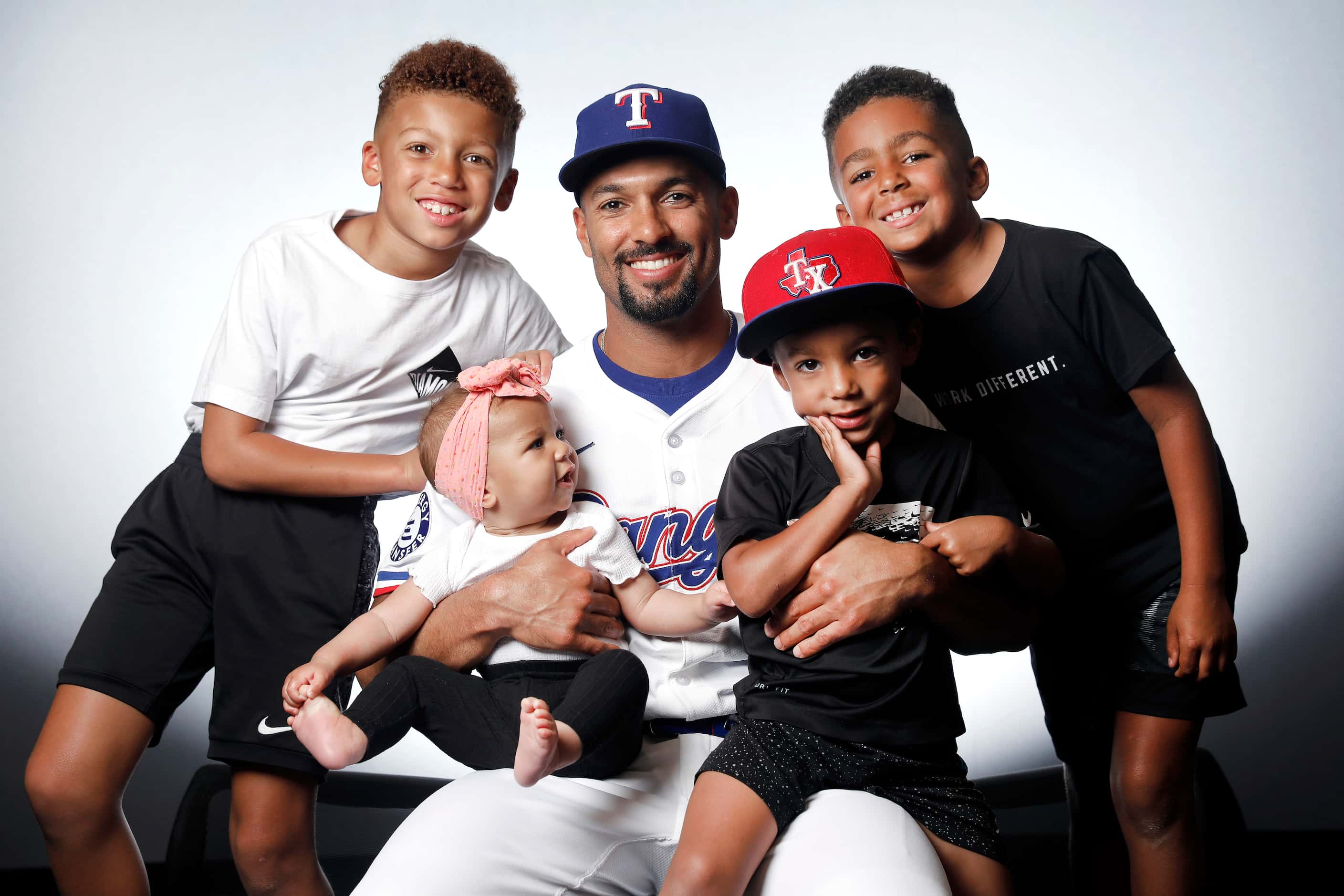 Texas Rangers Marcus Semien and his  children (from left) Isaiah, Amelie, Eli and Joshua at...