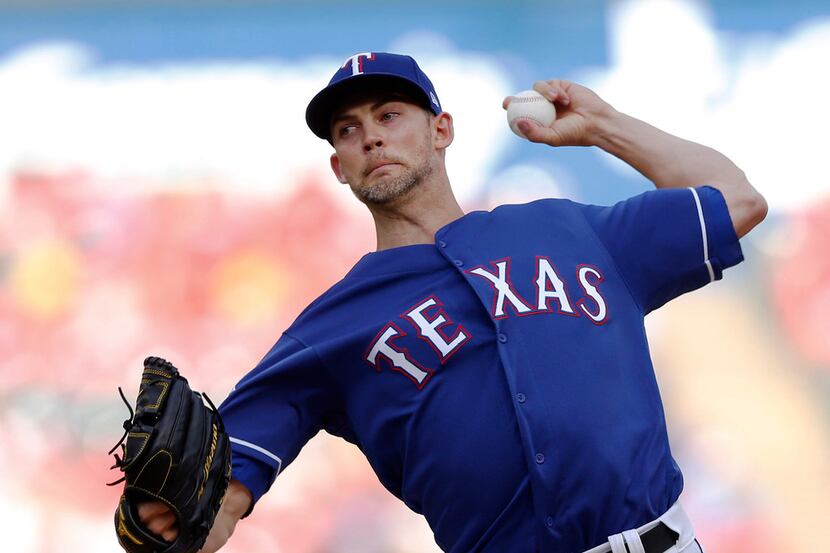Texas Rangers starting pitcher Mike Minor works against the Kansas City Royals at Globe Life...