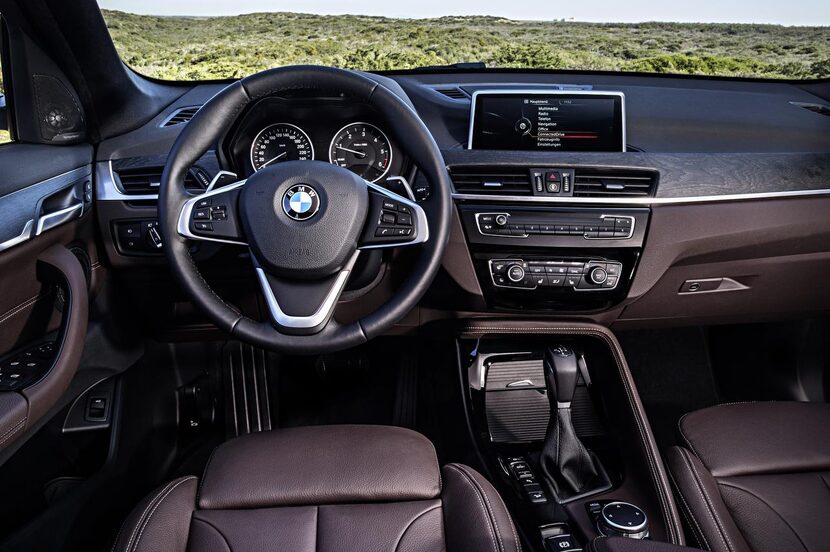 The BMW X1’s  black dashboard, black-faced instrument panel and tablet-shape display screen...