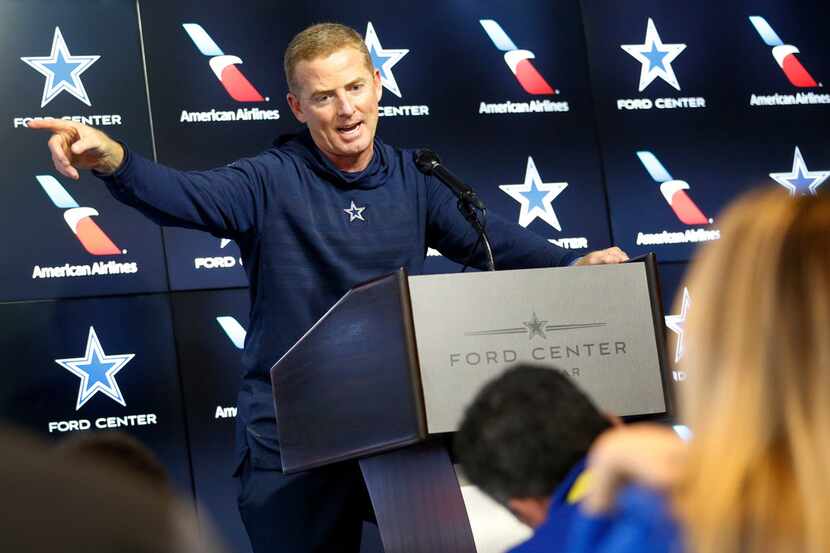 Dallas Cowboys head coach Jason Garrett responds to a question during a press conference at...