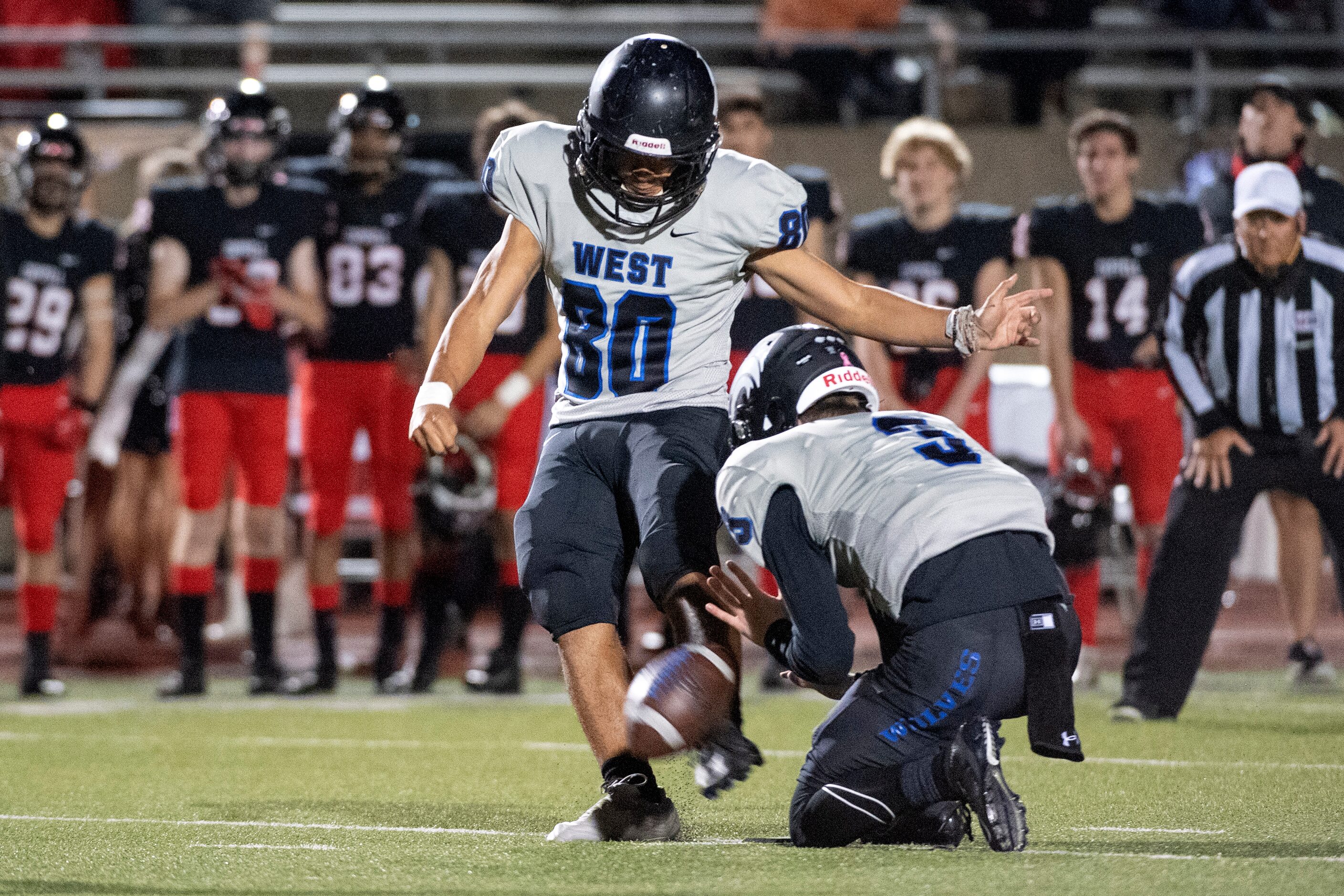 Plano West senior kicker Jesse Velez (80) kicks a 50-yard field goal as junior quarterback...