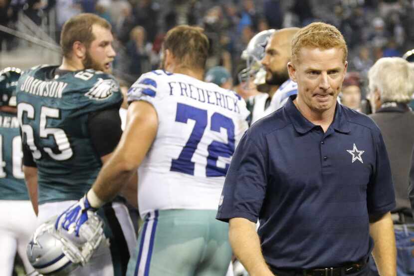 Dallas head coach Jason Garrett walks off the field after the Cowboys' 24-22 loss during the...