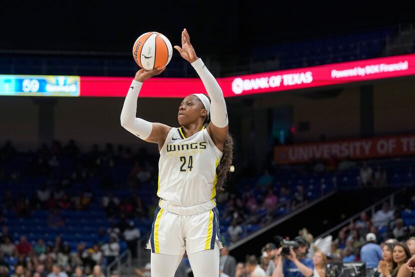 Dallas Wings guard Arike Ogunbowale (24) shoots during the second half of a WNBA basketball...