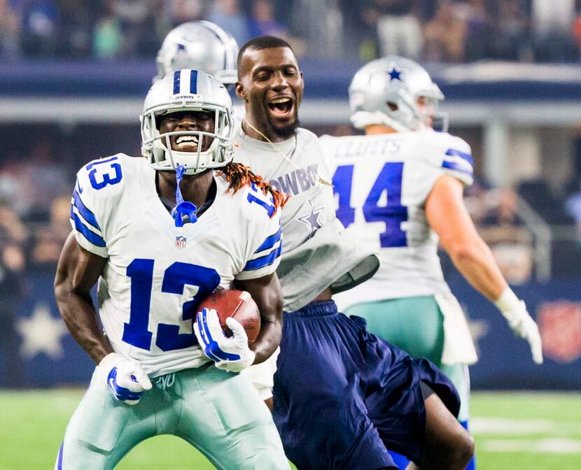 Dallas Cowboys wide receiver Lucky Whitehead (13) celebrates with wide receiver Dez Bryant...