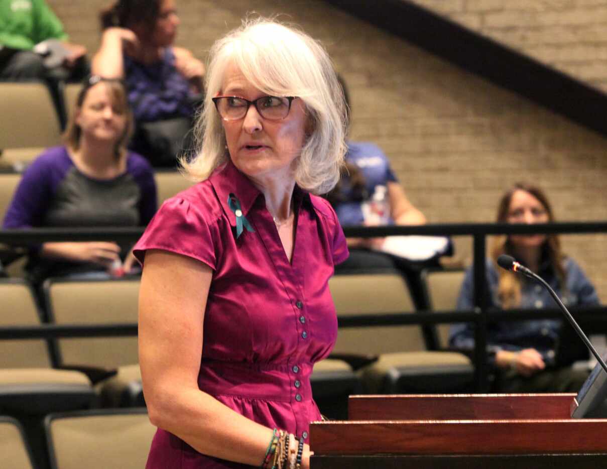 Wendy Hanna, executive director of The Turning Point, speaks from the podium at the Plano...