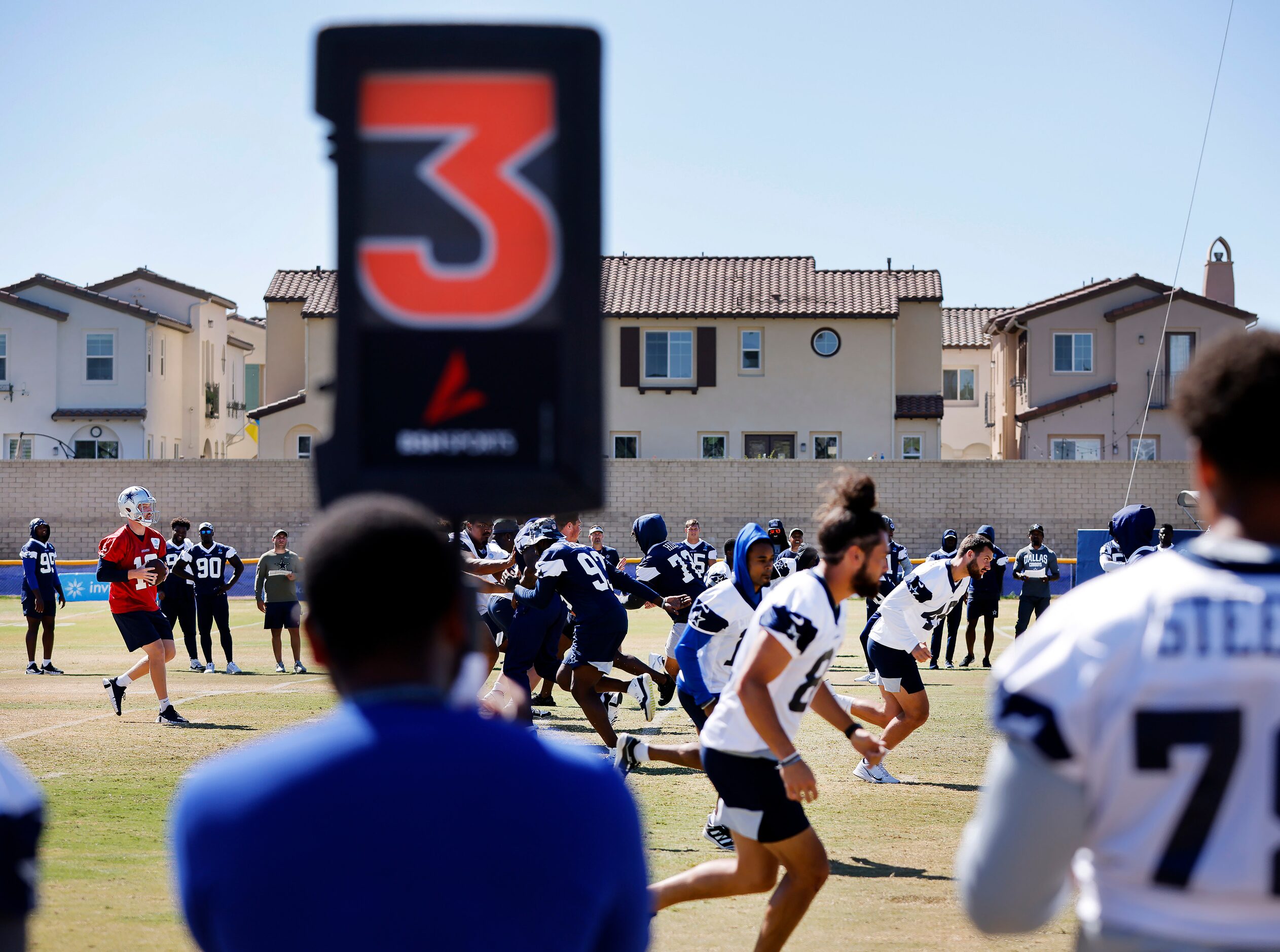 Dallas Cowboys quarterback Cooper Rush (10) drops back to pass during a training camp...