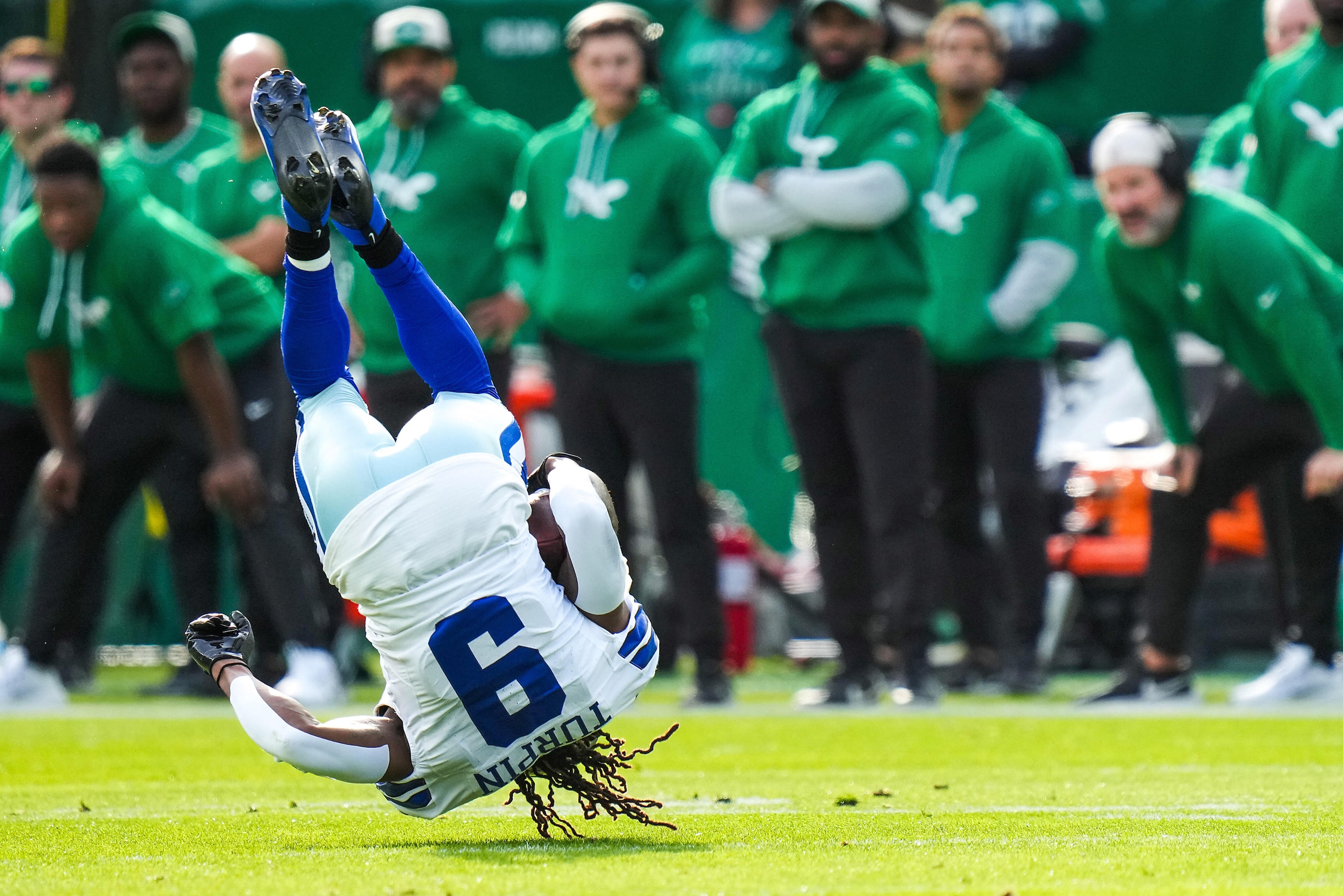 Dallas Cowboys wide receiver KaVontae Turpin (9) is upended during the first half of an NFL...