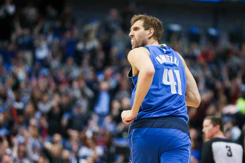 Dallas Mavericks forward Dirk Nowitzki (41) reacts after scoring three points during an NBA...