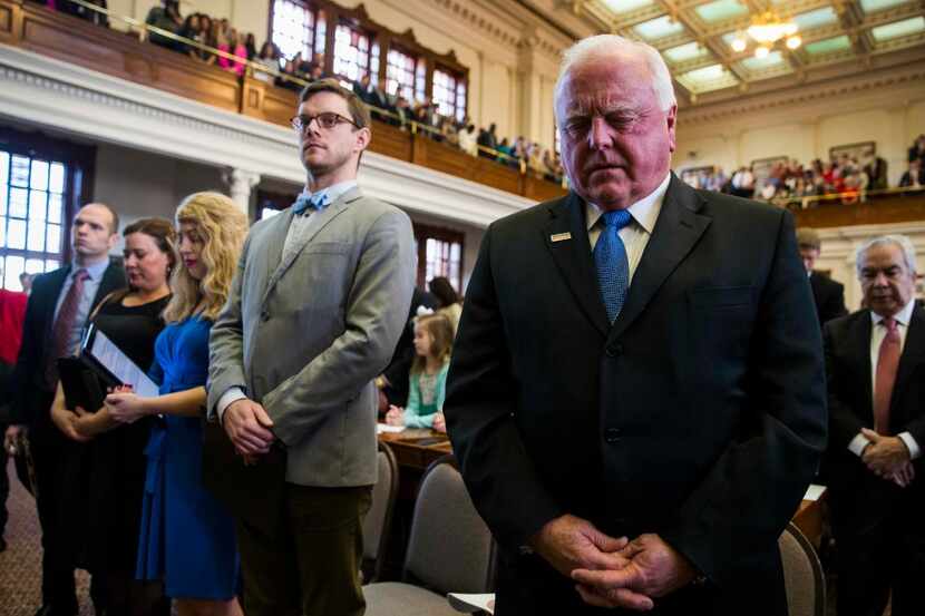Texas Agriculture Commissioner Sid Miller (right) prayed during the invocation on the first...