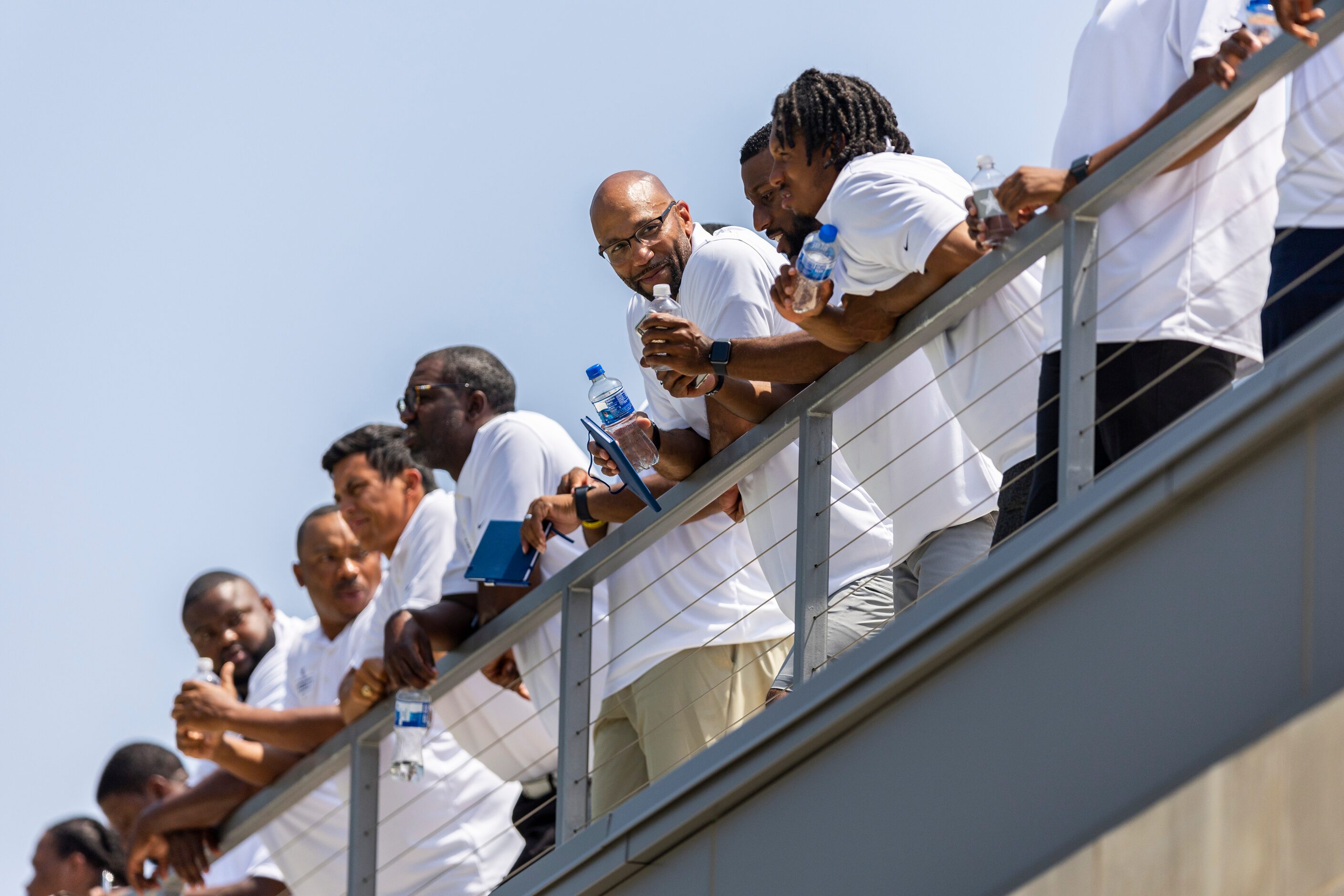 Texas high school football coaches attend a Dallas Cowboys practice during a High School...