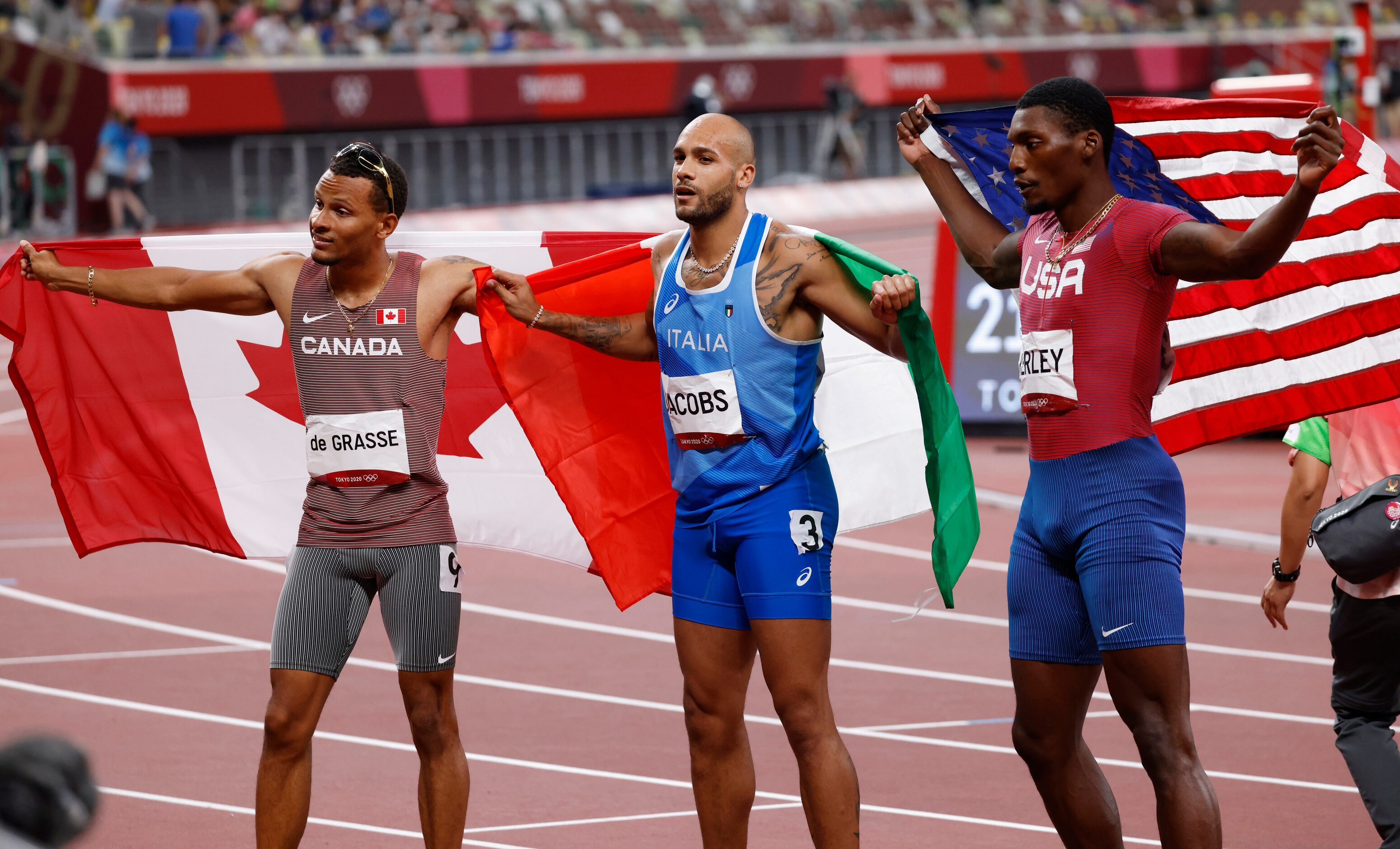 (From l to r) Canada’s Andre de Grasse, Italy’s Lamont Marcell Jacobs, and USA’s Fred Kersey...