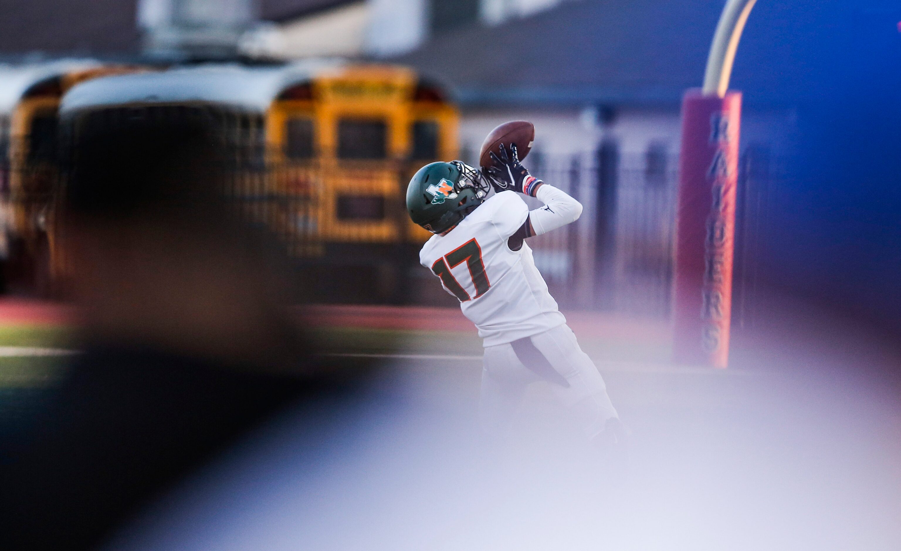 Garland Naaman Forest senior wide receiver Jaden Flores catches a pass and runs it in for a...