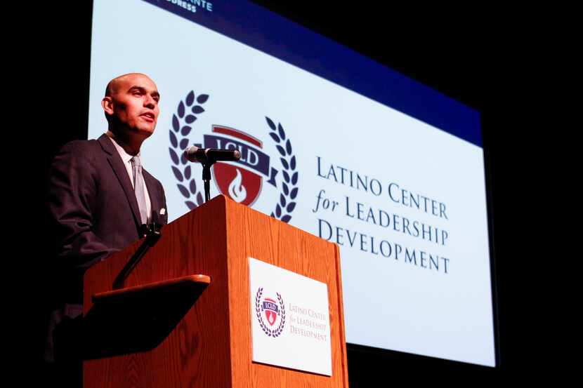 Latino Center for Leadership Development President Miguel Solis speaks to a crowd during the...