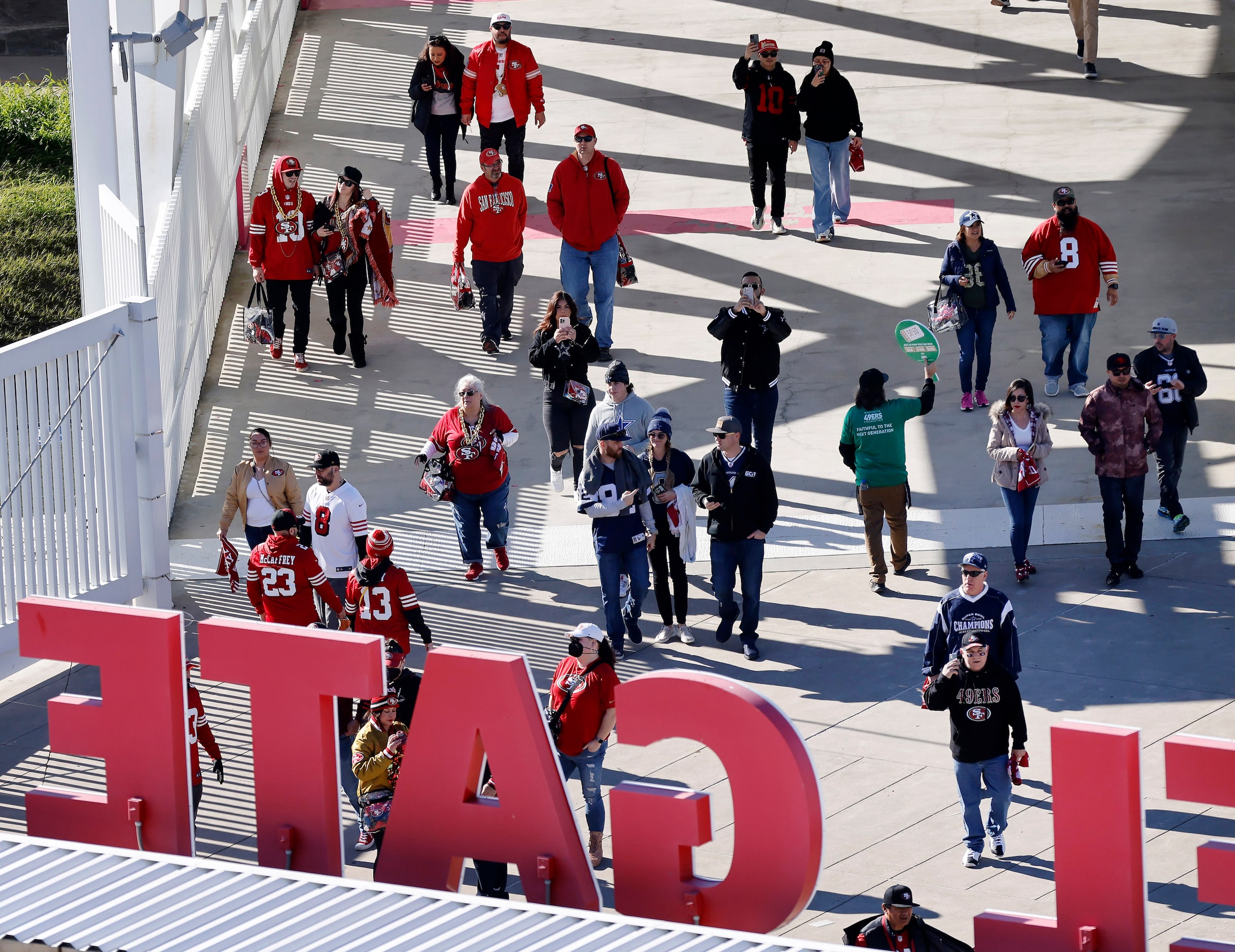 Dallas Cowboys and San Francisco 49ers fans wait to get into Levi’s Stadium in Santa Clara,...