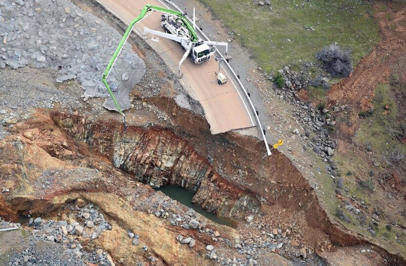 Crews work on a damaged section of the Oroville Dam in Oroville, Calif. on Monday. 
There...