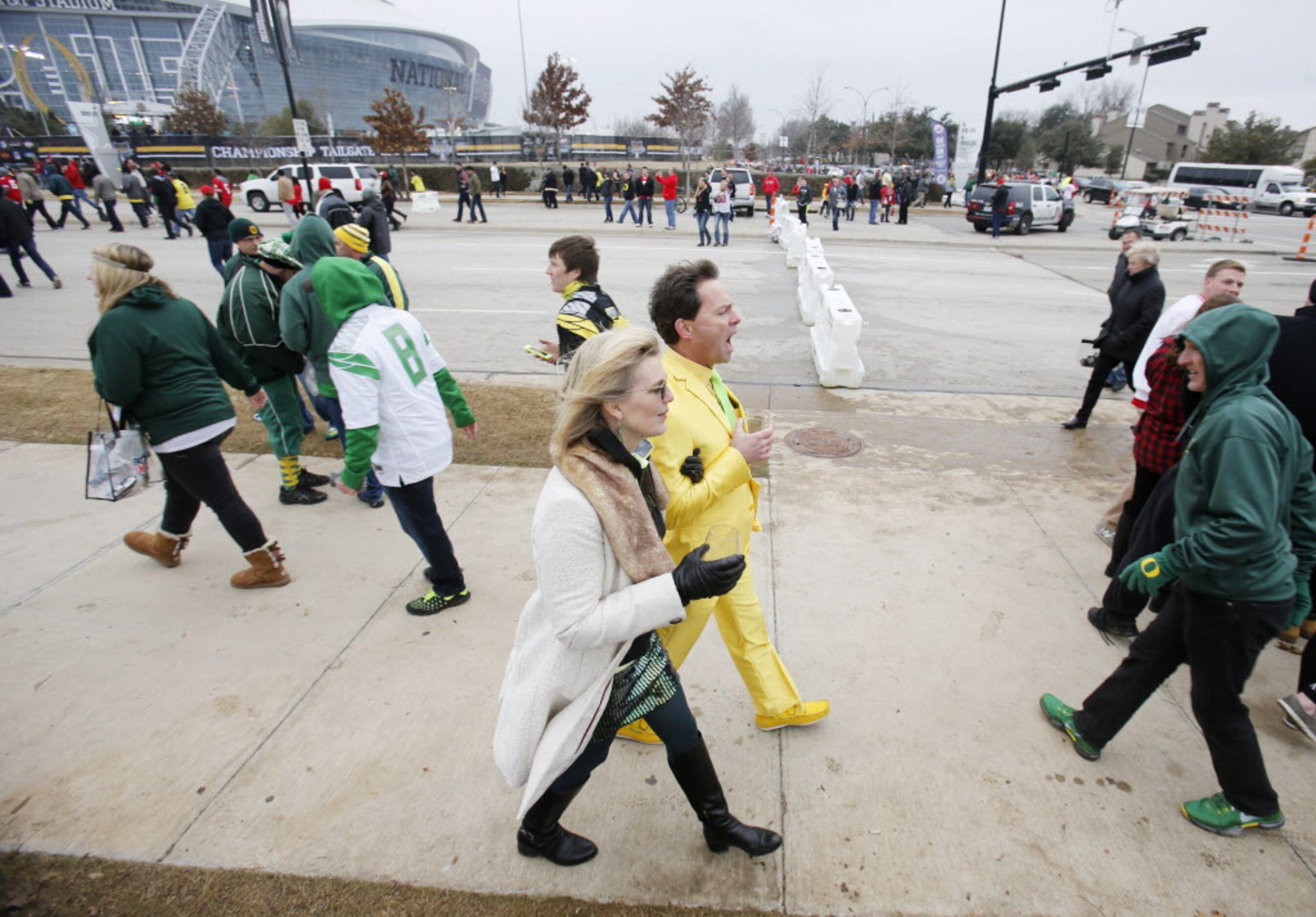 Fans make their way around the stadium before a game between Oregon and Ohio State...