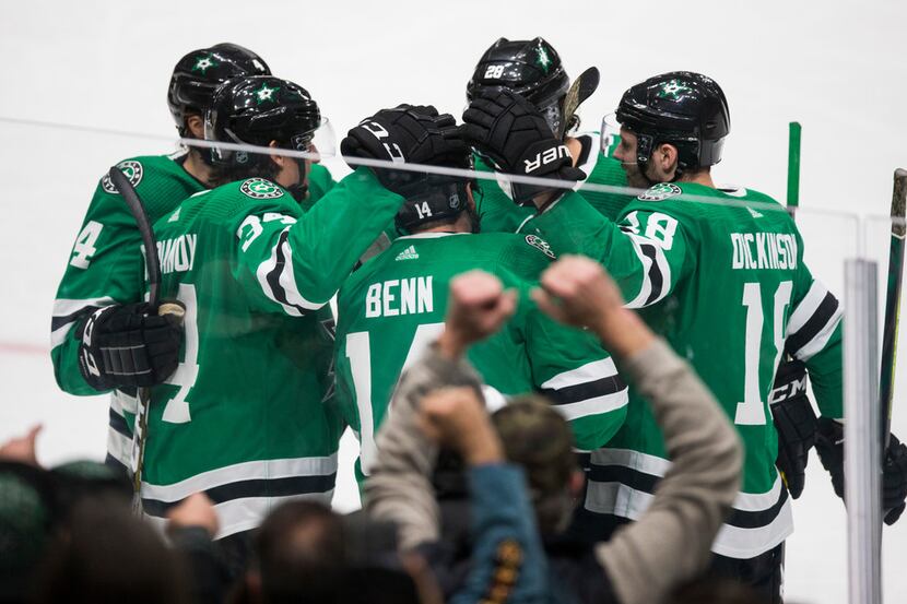 The Dallas Stars celebrate a goal scored by Jamie Benn (14) during the first period of a...